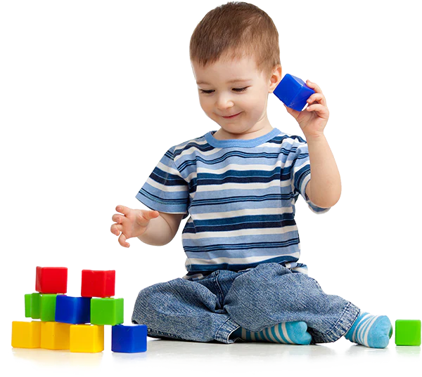 Toddler playing with colorful blocks
